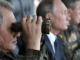 وزير الدفاع الروسي سيرغي شويغو والرئيس فلاديمير بوتين أثناء حضورهما للمناورات العسكرية في الميدان العسكري تسوغول منطقة ما وراء بايكال، 13 سبتمبر